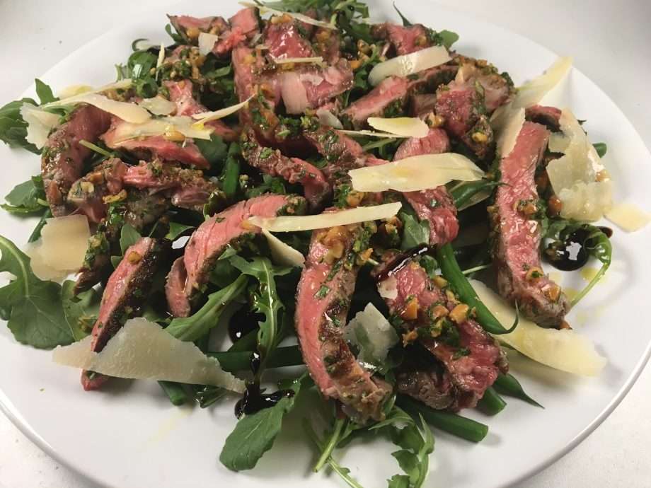 Tagliata with beans, rocket and shaved parmesan, pine nut gremolata
