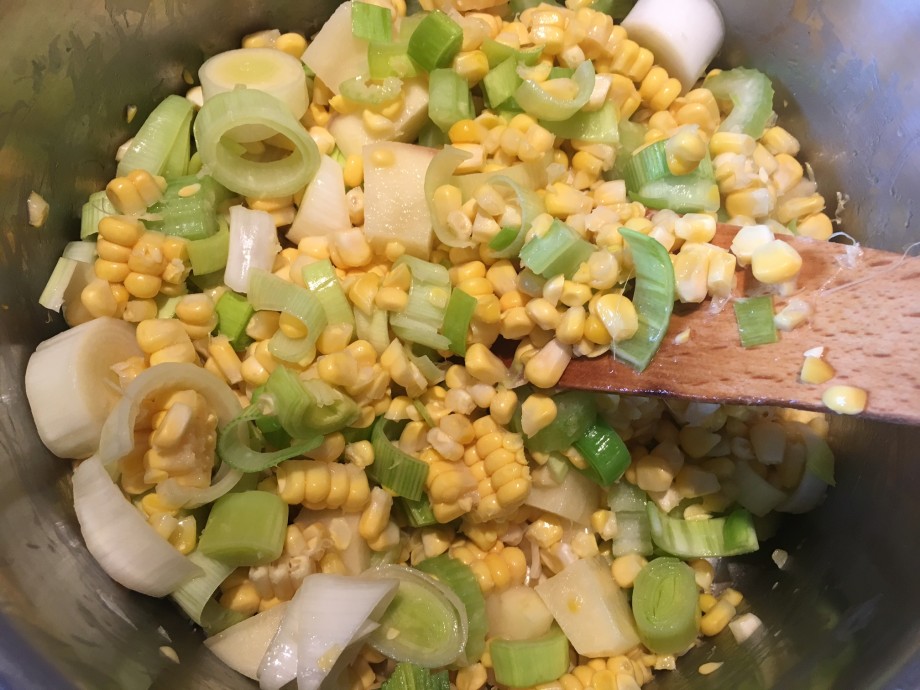 Corn soup with wild garlic cream